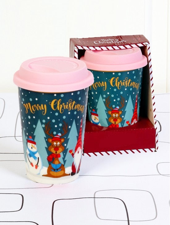 Christmas mug with snowman, reindeer and gnome image.  Gold typography says Merry Christmas