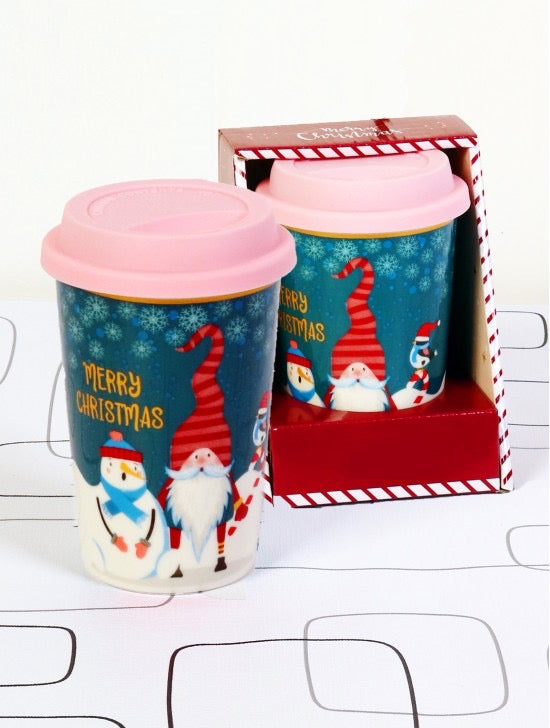 Christmas mug with lid features gnomes and snowman.  Typography says Merry Christmas.  Comes in gift box