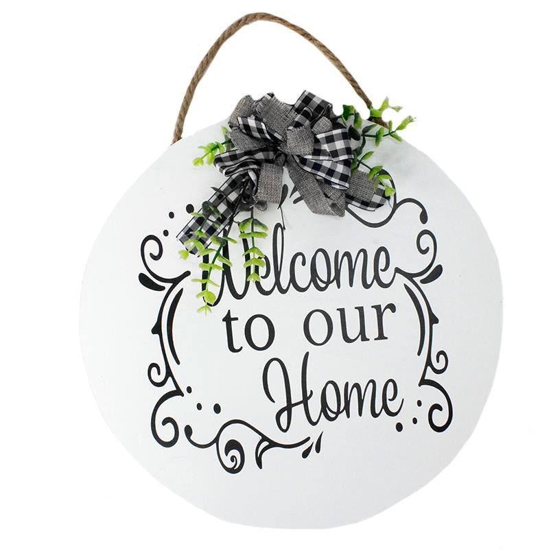 White circle “Welcome to our Home” sign.  Black plaid bow with green stems at top hangs from rope.  Home, porch decor.  6556752281764