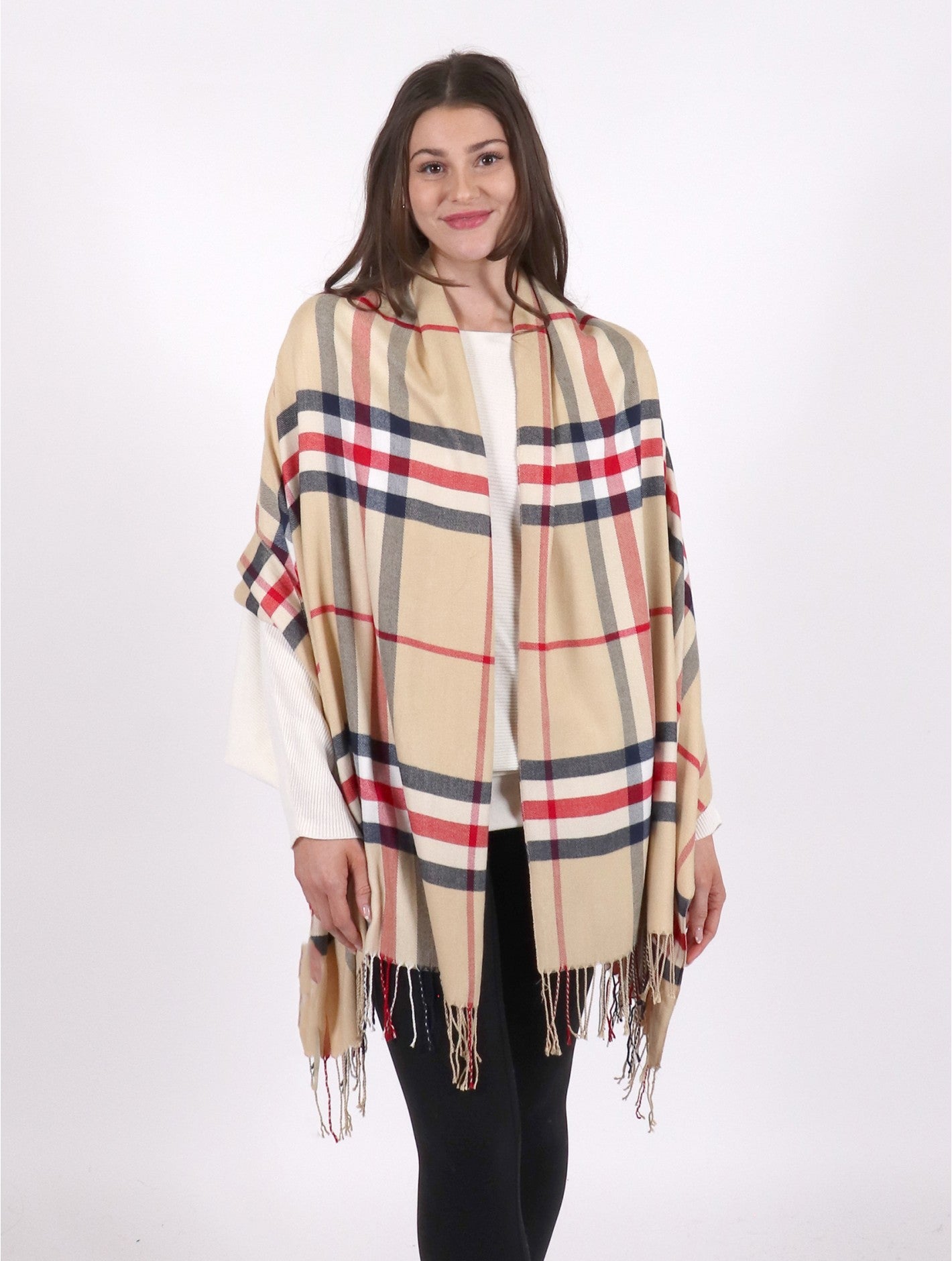 Lady wearing a beige and red plaid blanket scarf 