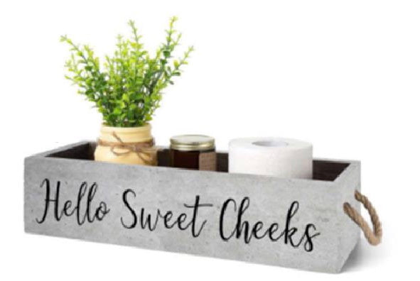 Hello Sweet Cheeks toilet caddy.  Moss Green with 2 rope handles.  Displayed inside is a plant in a mason jar a glass candle and a roll of toilet paper.   6556705718436