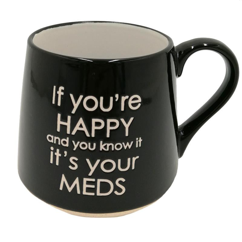 A black mug with white typography “if you’re happy and you know it it’s your meds.